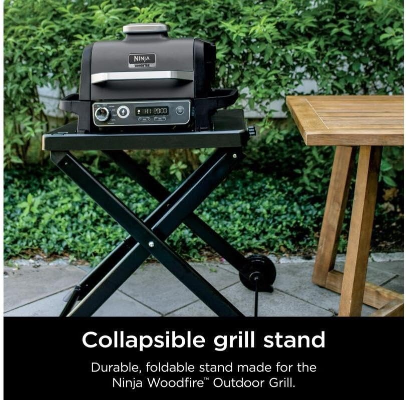 image:imageNinja XSKSTAND Woodfire Collapsible Outdoor Grill Stand Compatible with Ninja Woodfire Grills OG700 Series Foldable Side Utensil Holder WeatherResistant Black Ninja Woodfire Grill Stand collapses for storage locks in securely rolls on wheels with 3 utensil hooksWorks with OG700 series