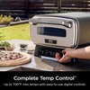 Ninja | Outdoor Pizza Oven with 19.5″ Perforated Pizza Peel | Includes 12″ Pizza Stone & 12″ Bake Pan | 5 Pizza Presets Neapolitan, Thin Crust, New York, Pan & Custom | 700F Max Temp | Electric(Pizza Oven + Peel)